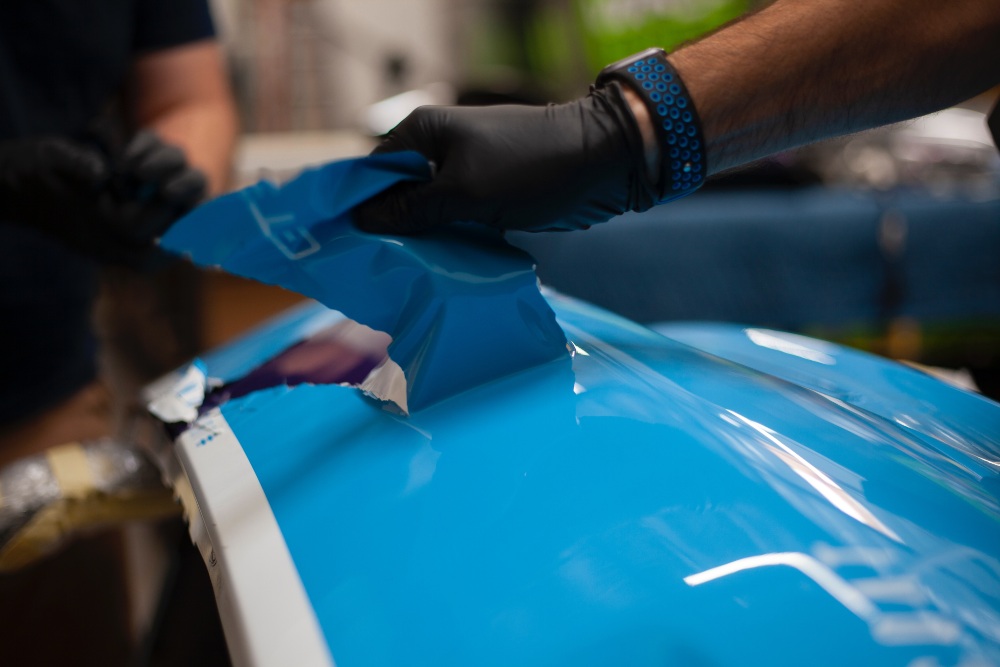 coat getting peeled off of a car body panel